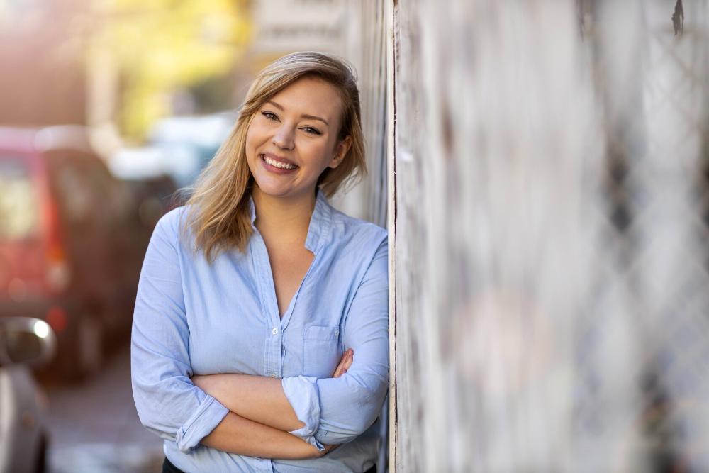woman smiling after getting dental bonding