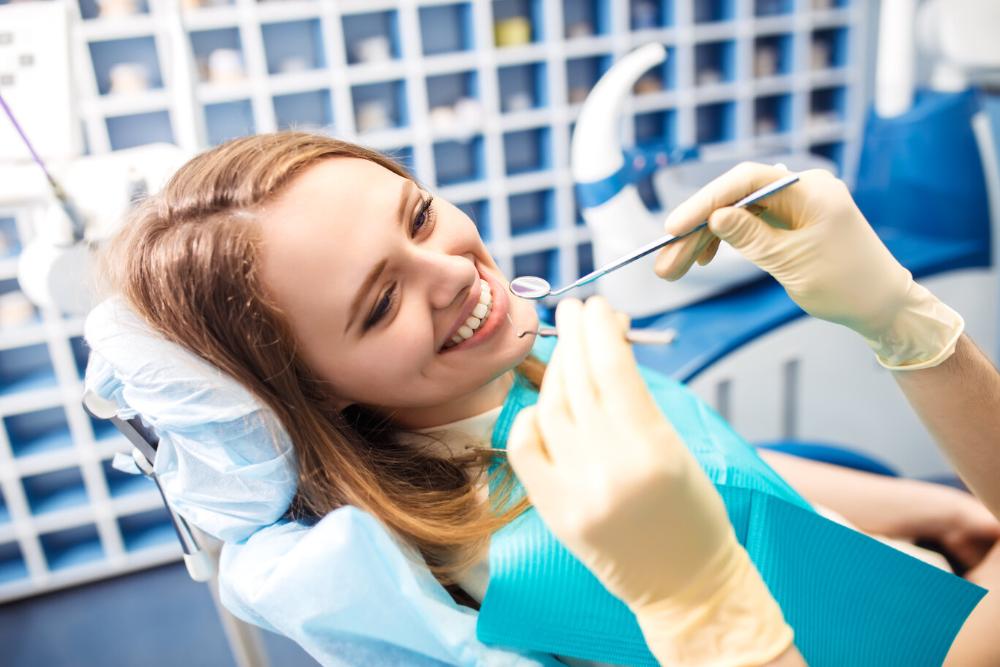 woman smiling after getting periodontal treatment in casuarina