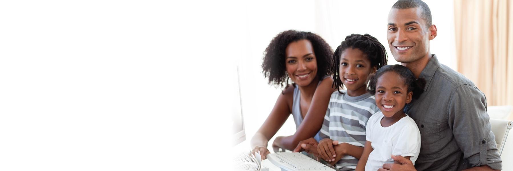 Family sitting & smiling l Dentist in Casuarina NT