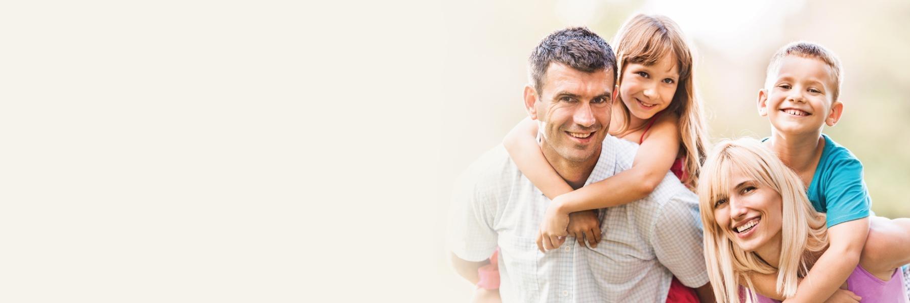 Young Family Hugging & Smiling 