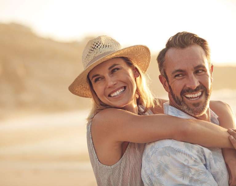An image of a smiling couple after teeth whitening treatment in Casuarina NT