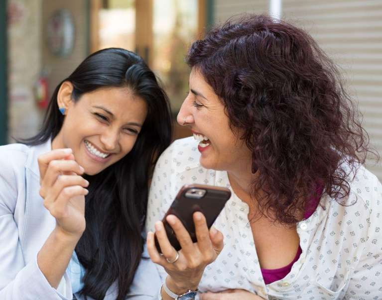 Two women smiling after getting Dental Veneers in Casuarina, NT