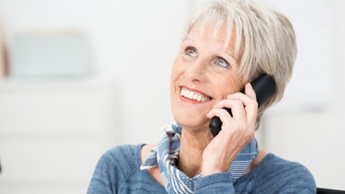 A woman smiling after getting cost effective plan in Darwin, NT