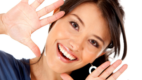 A woman smiling after an orthodontic treatment in Casuarina, NT