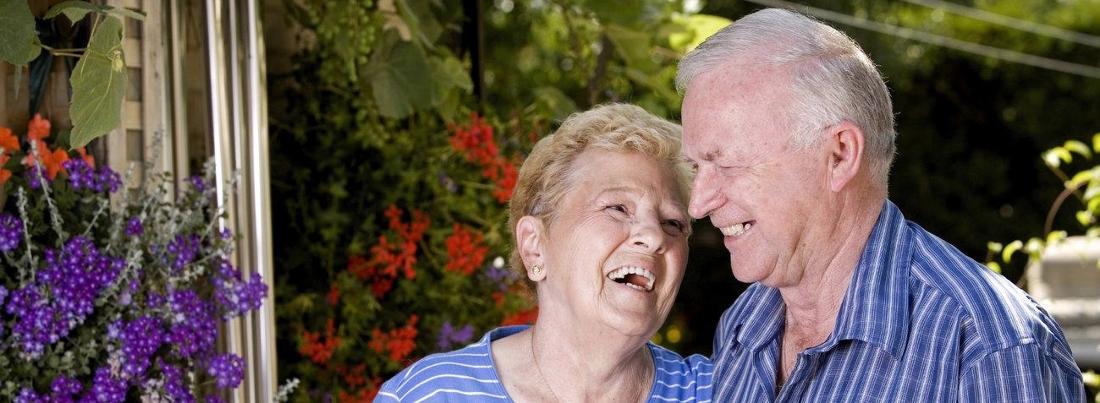 an older couple laughs together